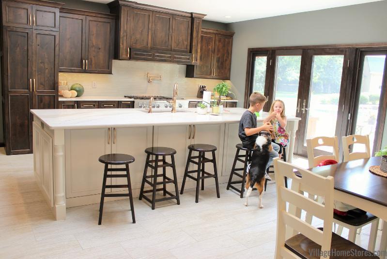 This Coal Valley Illinois kitchen just got a whole new look and layout! We made functional changes (like that new view and access to the pool shown below) and updated the look and style of the entire main level of this home